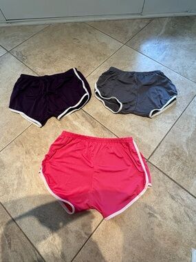 New 3-Pack Sports Shorts in Gray, Purple & Pink. 95% polyester 5% spandex.